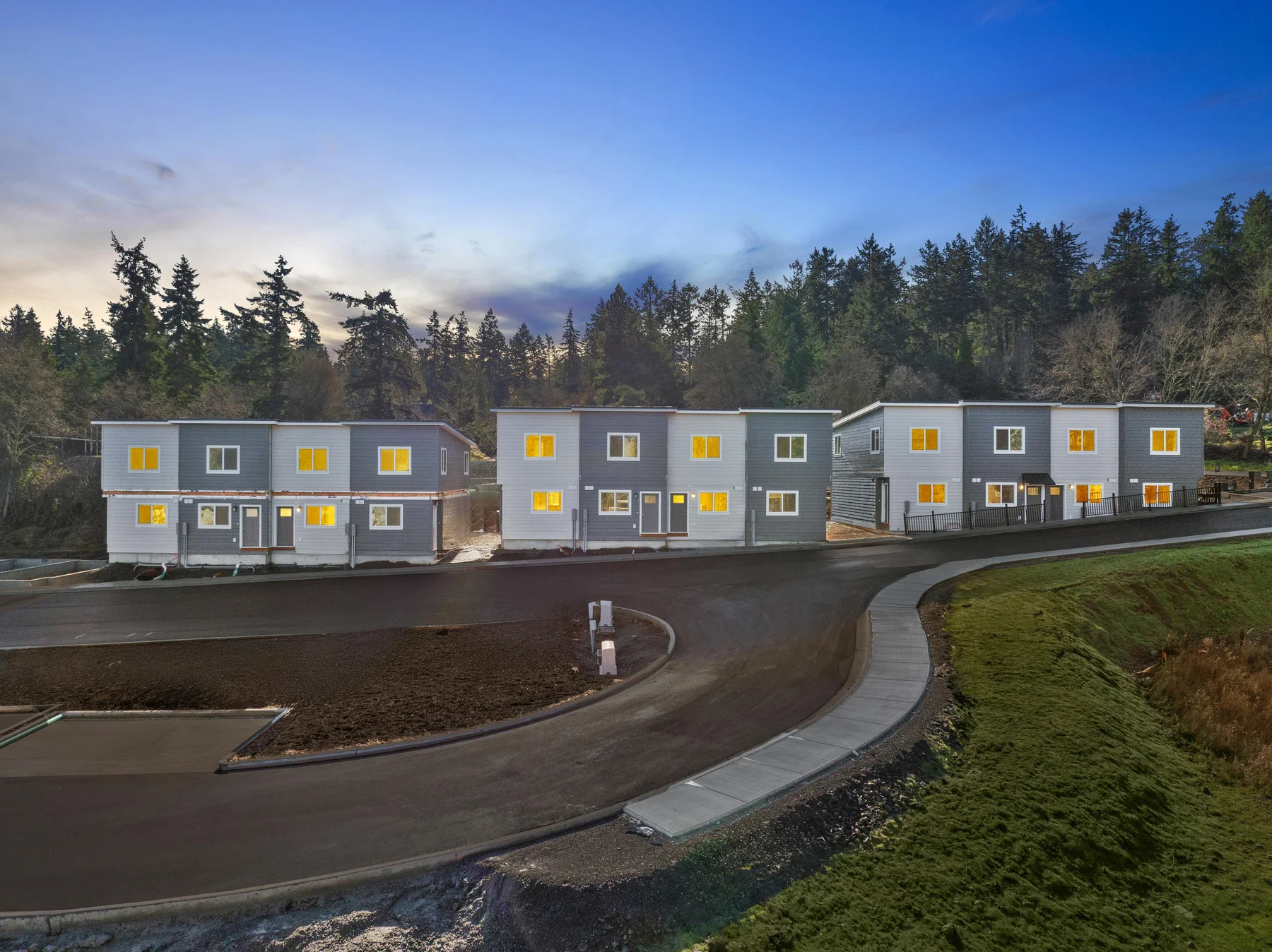 Digitally created twilight view of the Guard Street townhome community